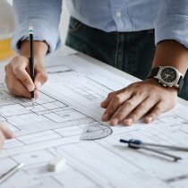 close up of team engineer or architect meeting for project working with partner and engineering tools on model building and blueprint in working site. Construction concept