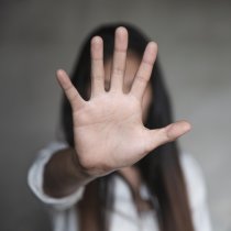 woman raised her hand for dissuade, Abuse, campaign stop violence against women. Stop sexual harassment and rape.